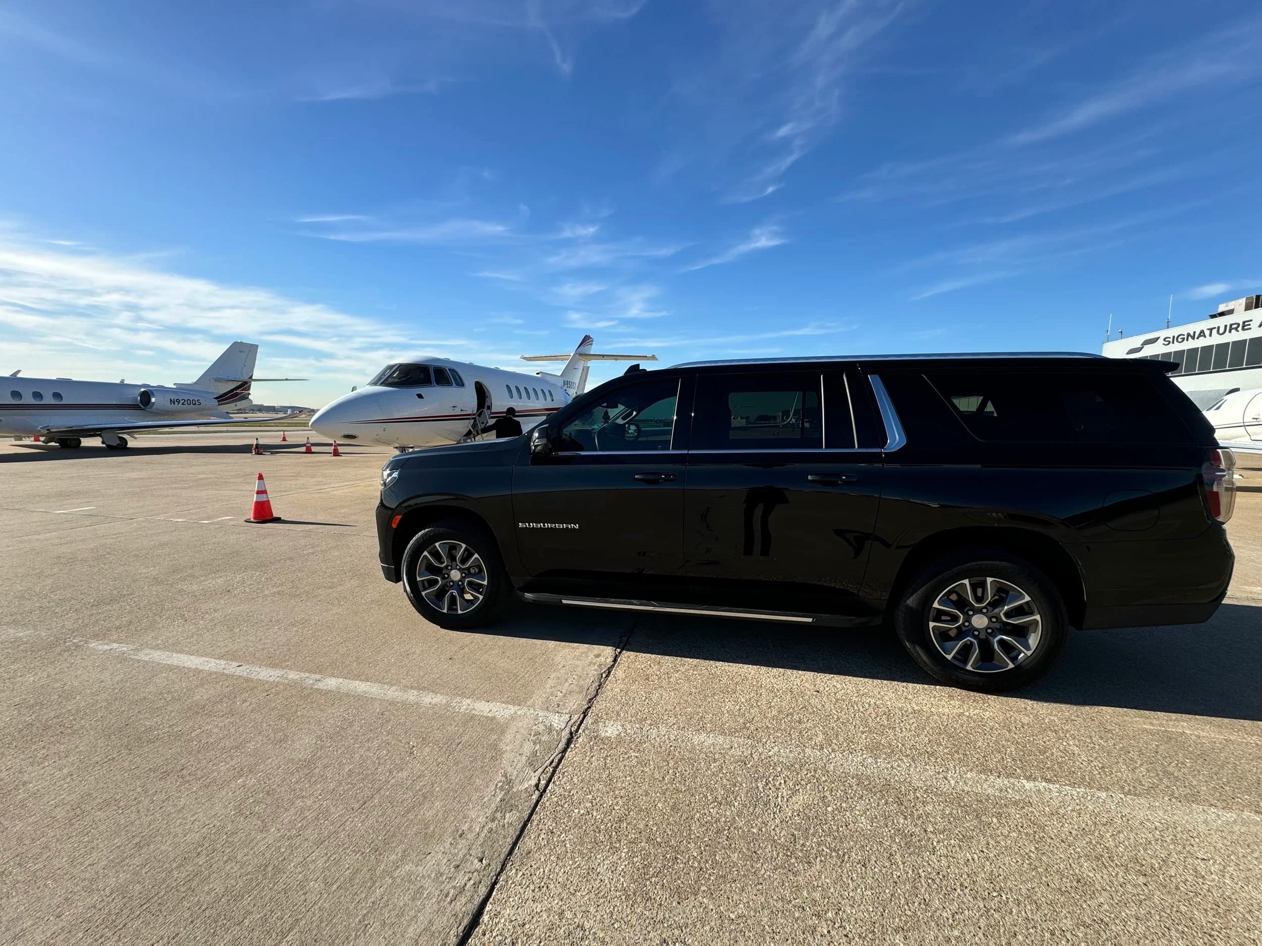 Luxury chauffeur assisting with airport luggage